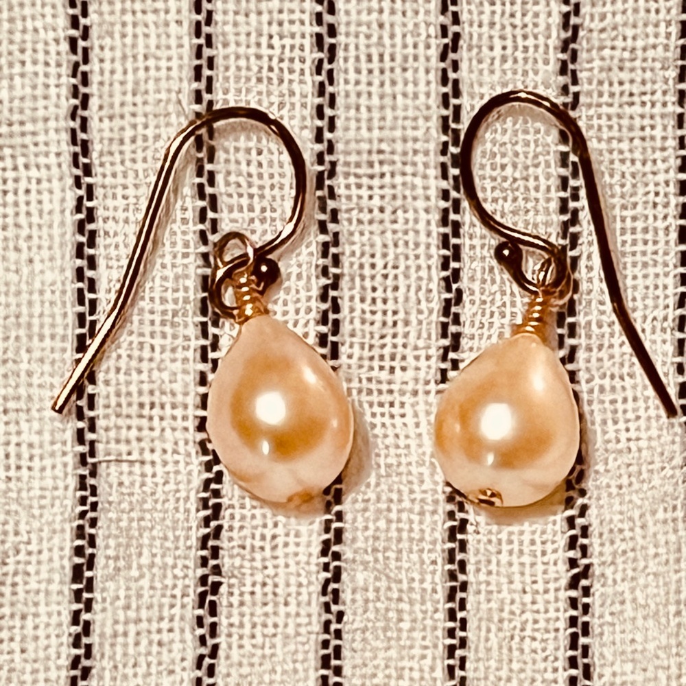 Peach pearl dangle earrings on rose gold wires